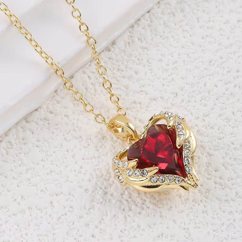 Soft Embrace gold necklace with ruby heart