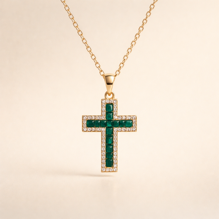 Elegant gold necklace with emerald cross pendant