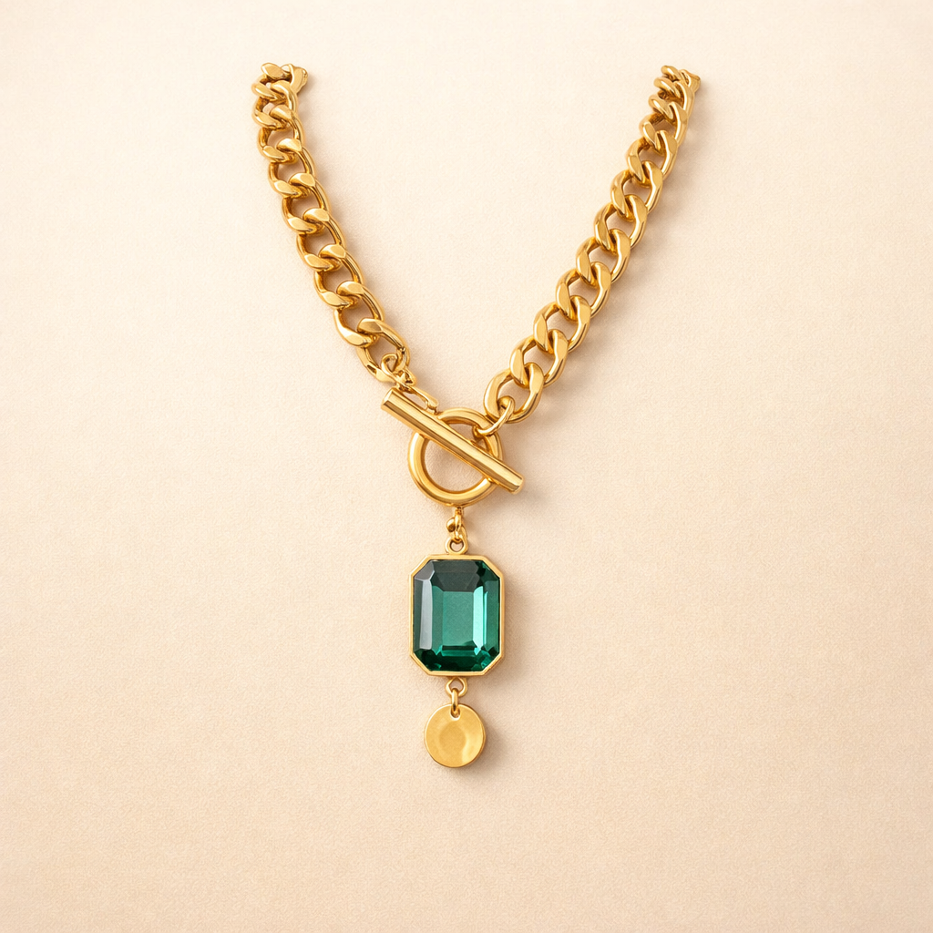 Elegant gold necklace with emerald pendant