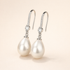 Elegant white gold earrings with clear pearl