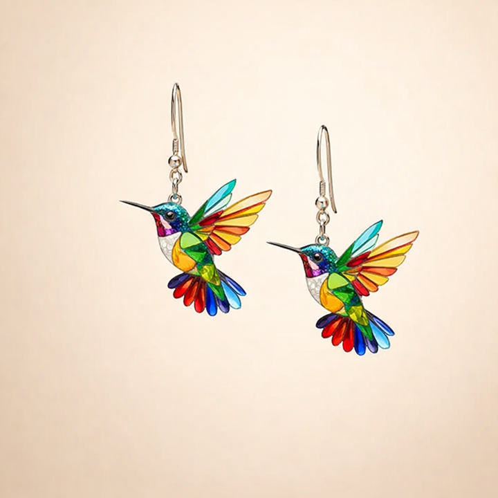 Elegant white gold earrings with colorful hummingbird
