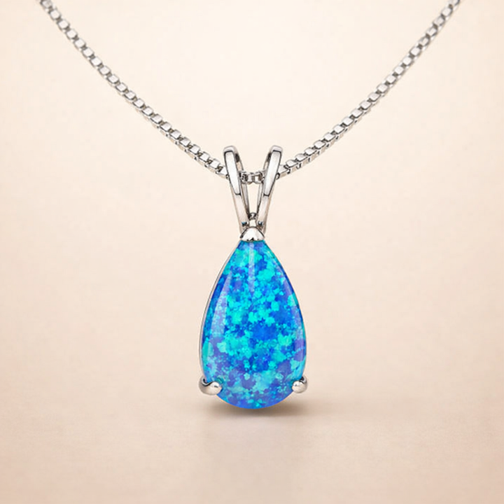Soft white gold drop necklace with opal accent