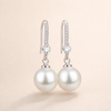 Elegant white gold pearl earrings with cubic zirconia