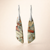 Elegant gold earrings with antique natural stone