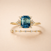 Soft shine ring set in gold with crystal-blue accents