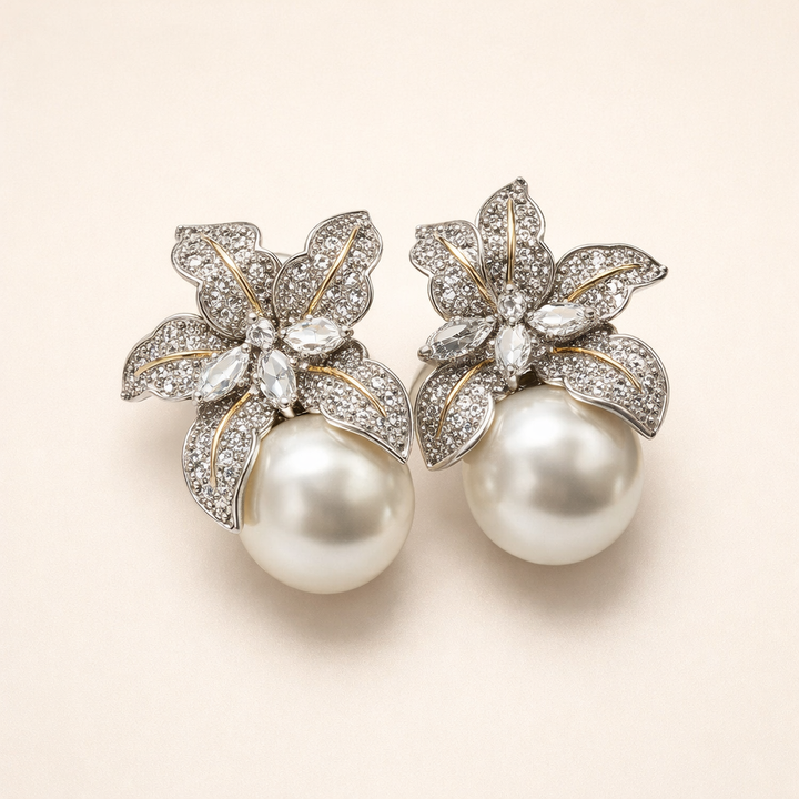 Elegant white gold pearl earrings with flower details