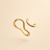 Wavy gold ring with organic shapes
