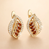 Soft gold earrings with a rosé shine
