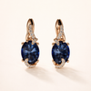 Elegant gold earrings with a refined hanging link