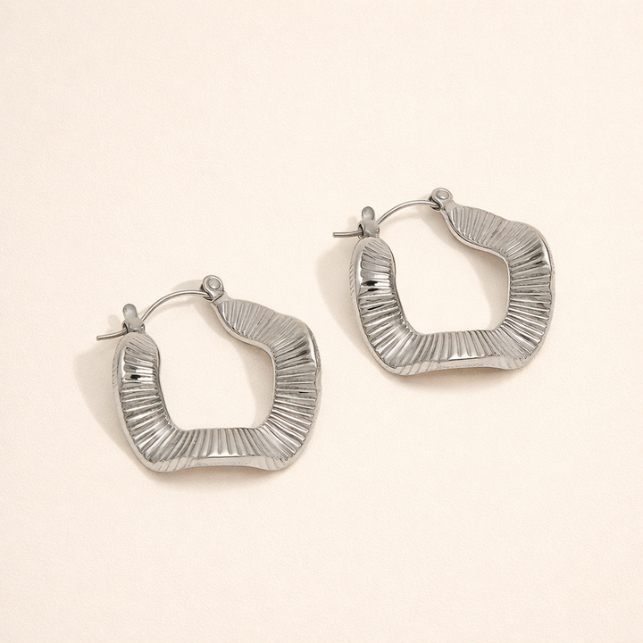 Elegant silver hoops with subtle waves