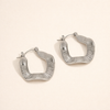 Elegant silver hoops with subtle waves