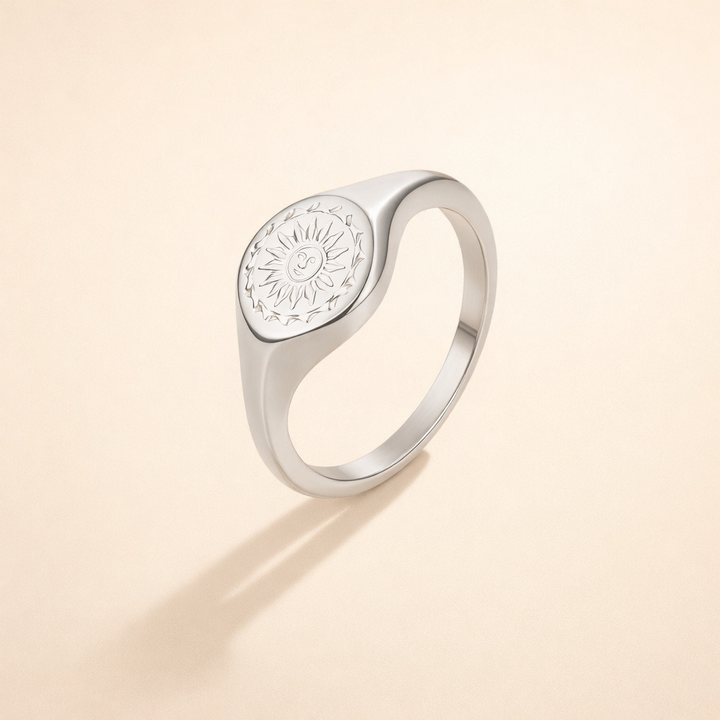 Silver ring with sunburst motif