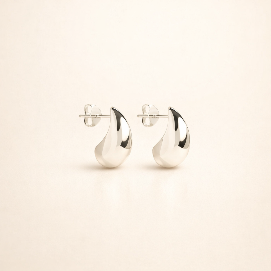 Elegant white gold earrings with subtle dangling elements