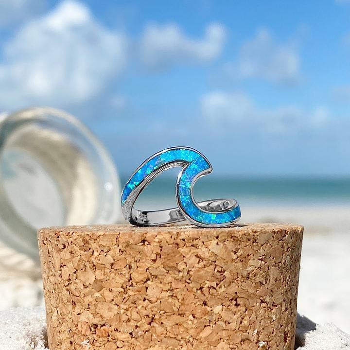 Silver ring with opal and wavy shapes