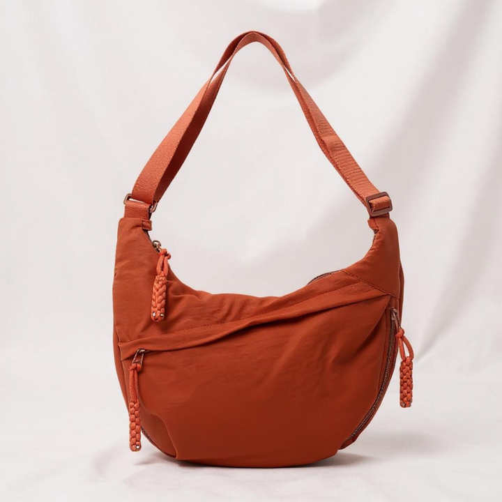 Orange half-moon shoulder bag