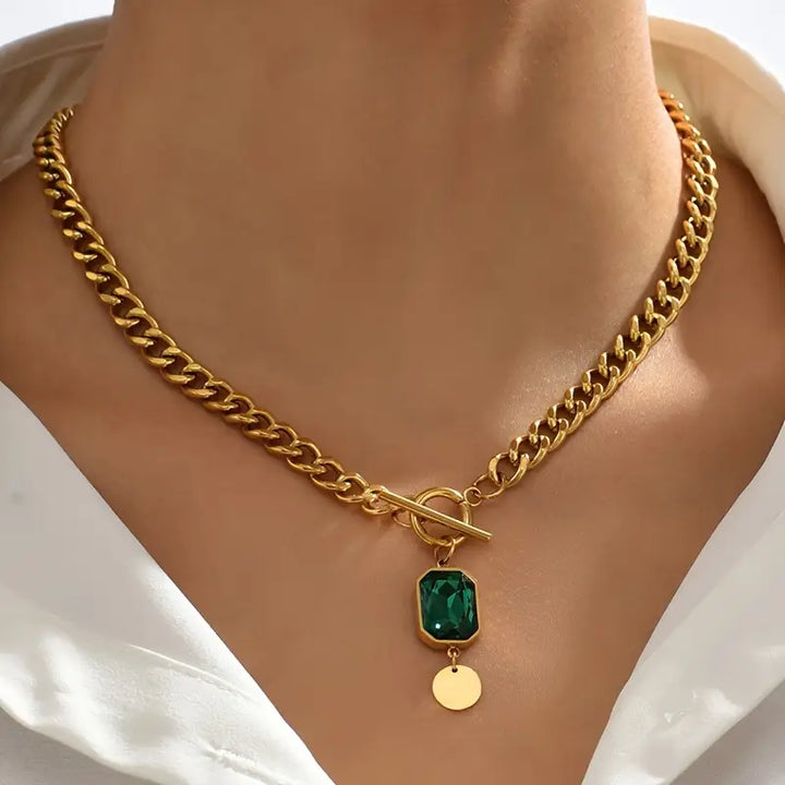 Elegant gold necklace with emerald pendant