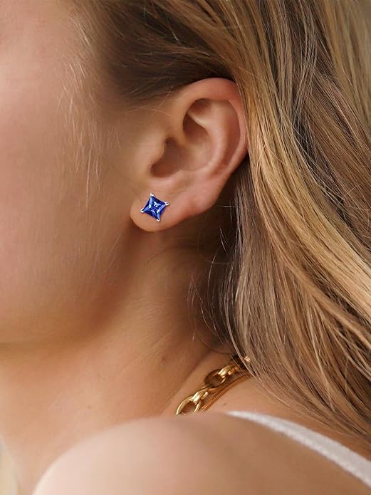 Elegant white gold earrings with princess-cut sapphire