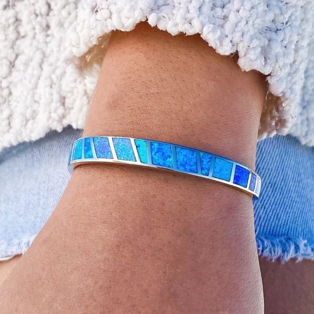 Silver bracelet with blue opal and refined details
