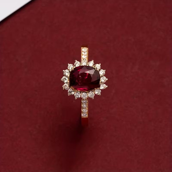 Elegant gold ring with red cubic zirconia