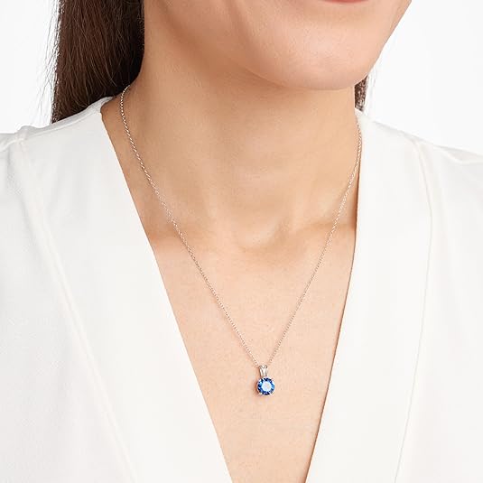 Elegant white gold necklace with round-cut sapphire