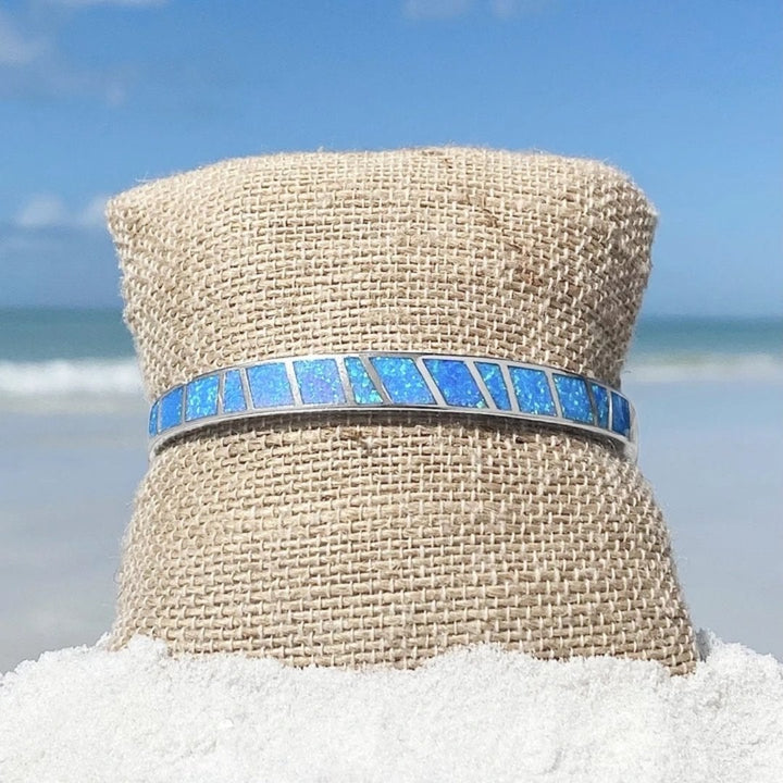 Silver bracelet with blue opal and refined details