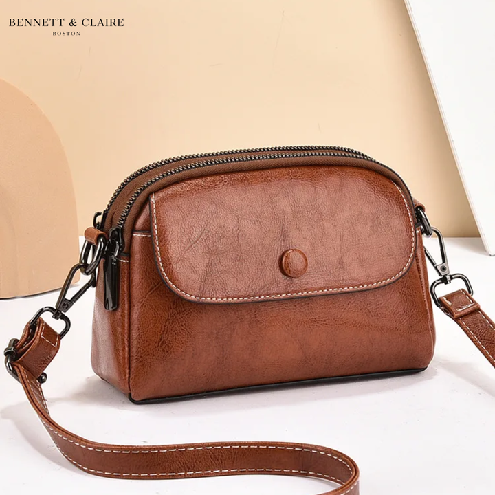Cross-body bag with multiple pockets and adjustable strap