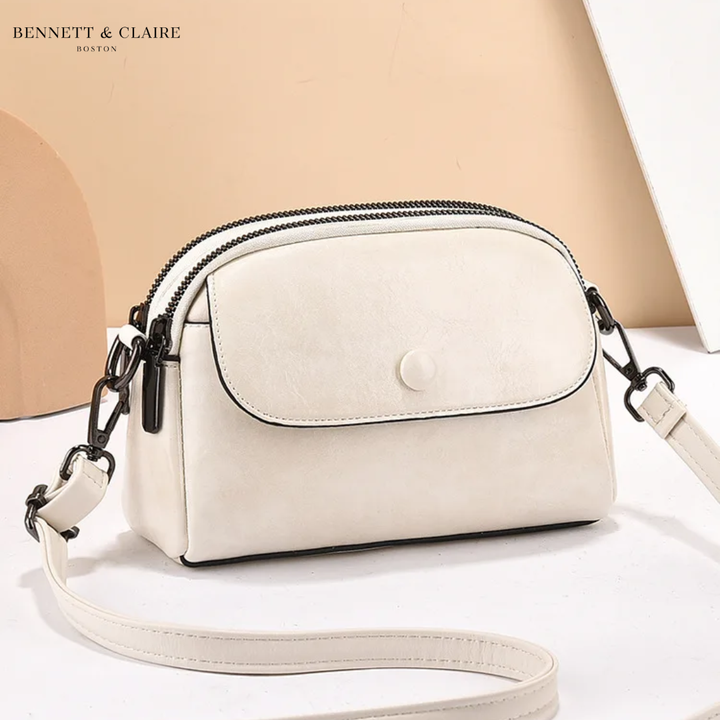 Cross-body bag with multiple pockets and adjustable strap