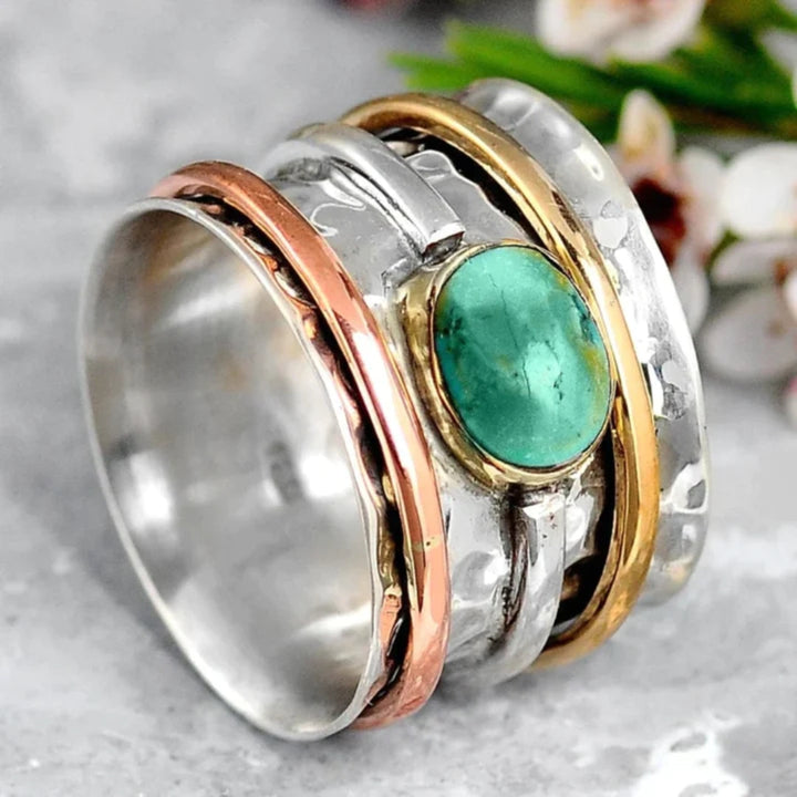 Elegant gold ring with turquoise and refined details
