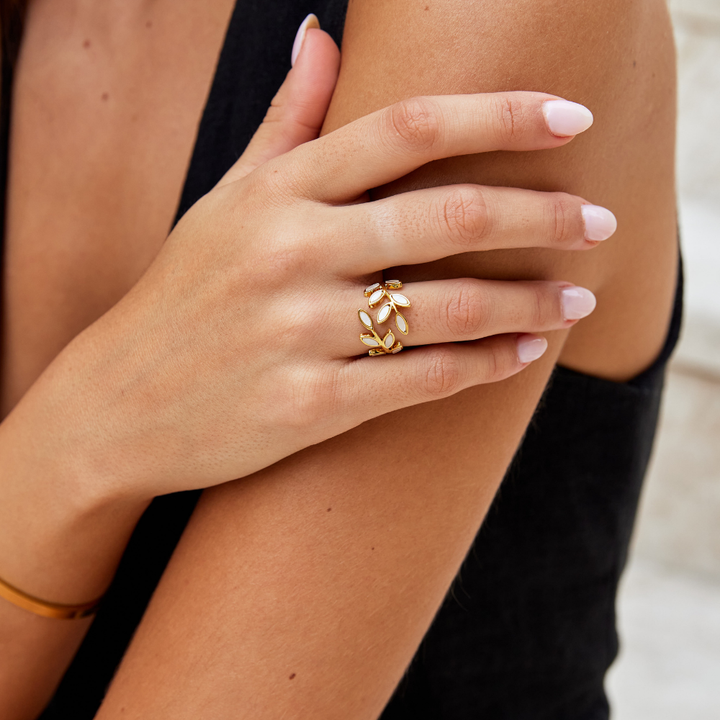 Serene gold ring with delicate little leaves