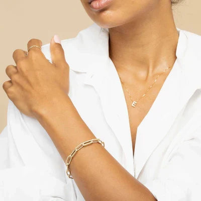 Refined white gold necklace with initial pendant.