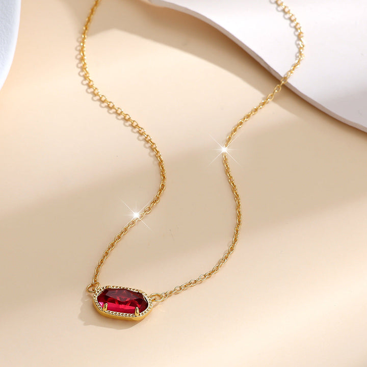 Elegant gold necklace with oval ruby