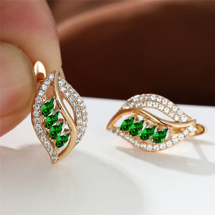 Refined gold earrings with subtle leaves