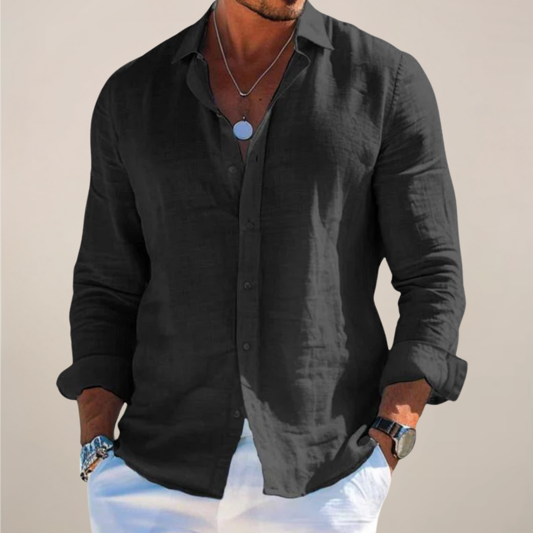 Relaxed-fit men's linen shirt with front button placket and long sleeves.
