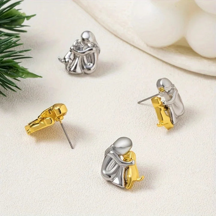 Minimalist silver earrings with subtle round shapes