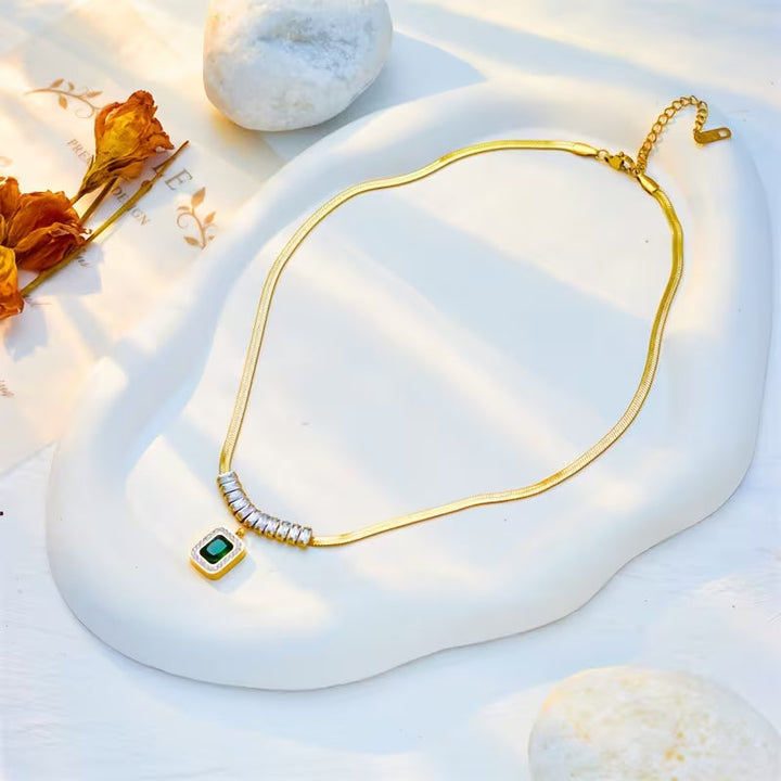 Elegant Gold Pendant with Emerald Prism