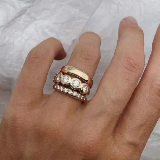 Forged gold rings with brilliant accents