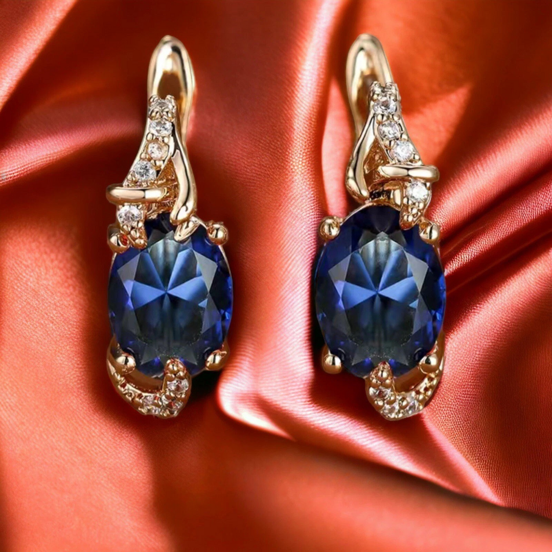 Elegant gold earrings with a refined hanging link