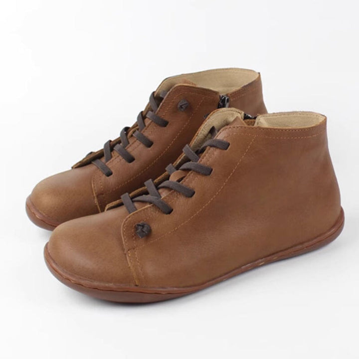 https://cdn.shopify.com/s/files/1/1014/6666/9387/files/dwarves389-35-boots-55-brown-718653.jpg?v=1769454710