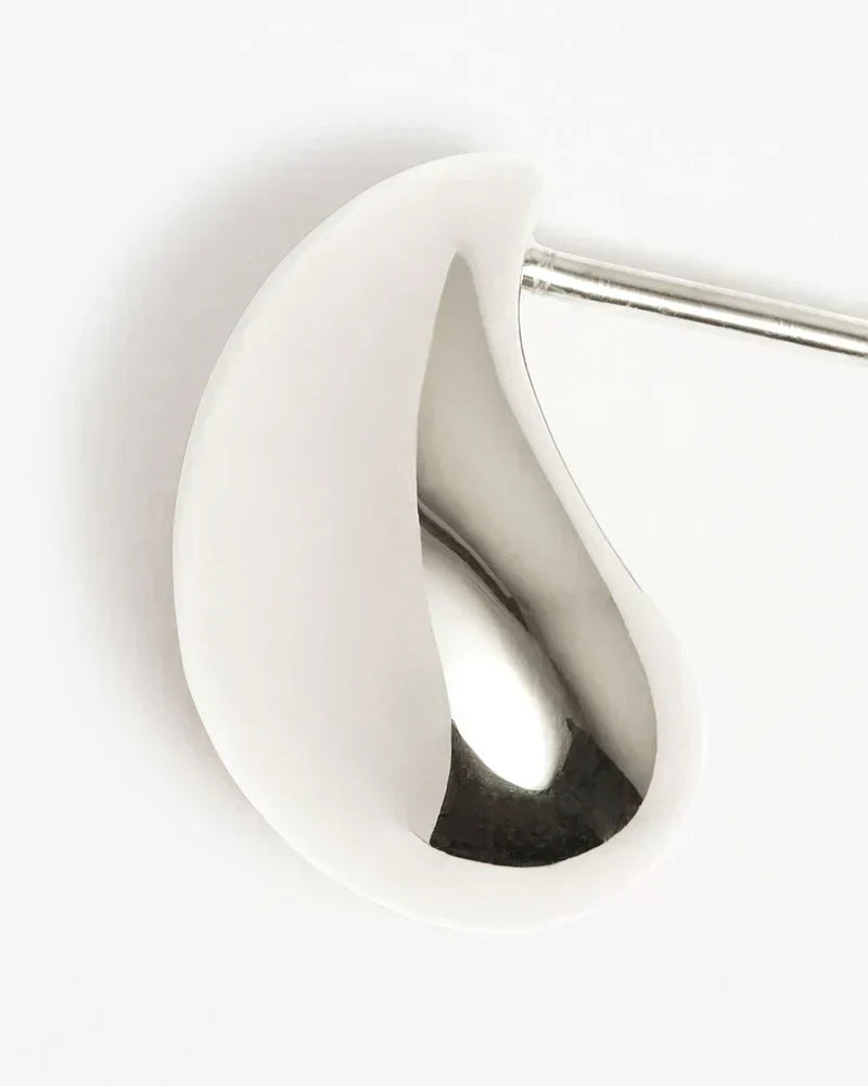 Elegant white gold earrings with subtle dangling elements