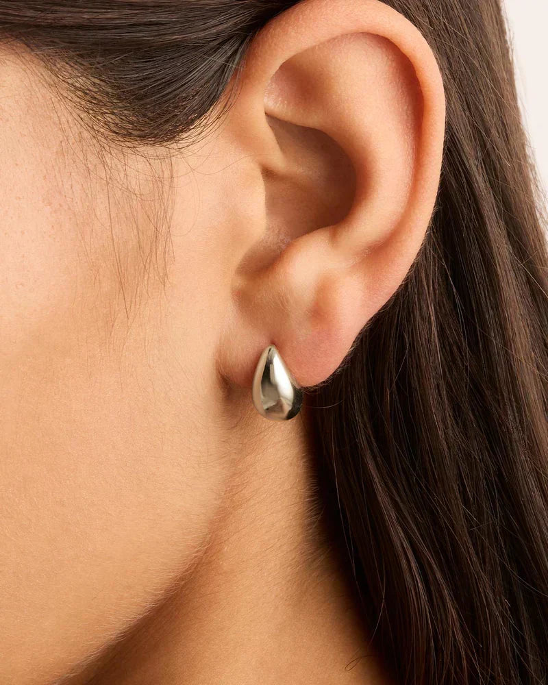 Elegant white gold earrings with subtle dangling elements