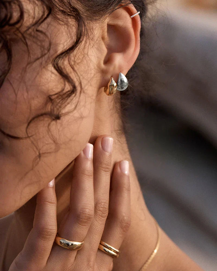 Elegant white gold earrings with subtle dangling elements