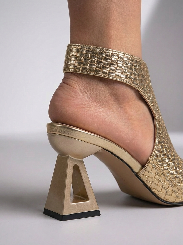 Elegant woven sandals with open toe and sculpted heel.