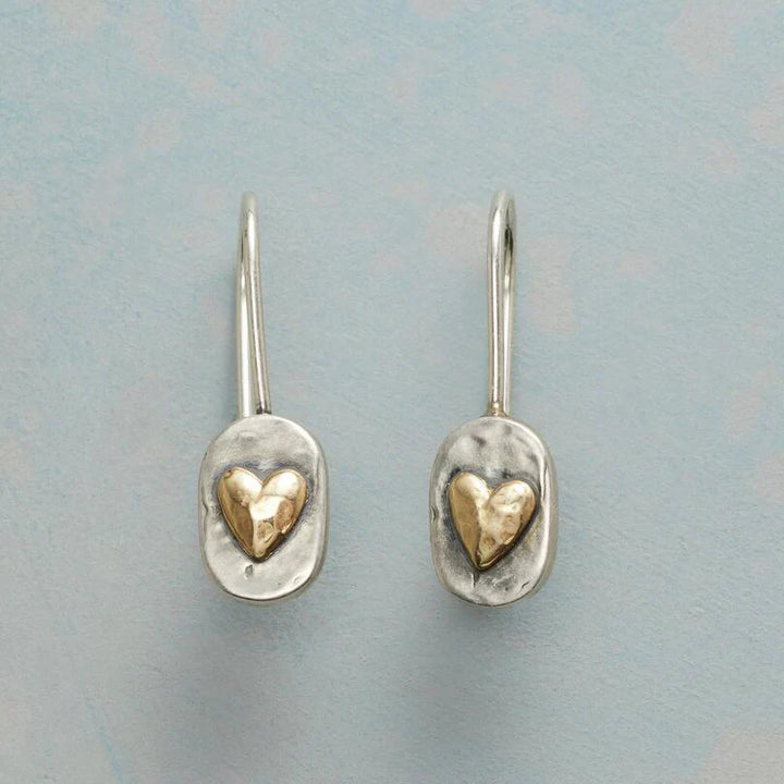 Elegant gold earrings with little heart