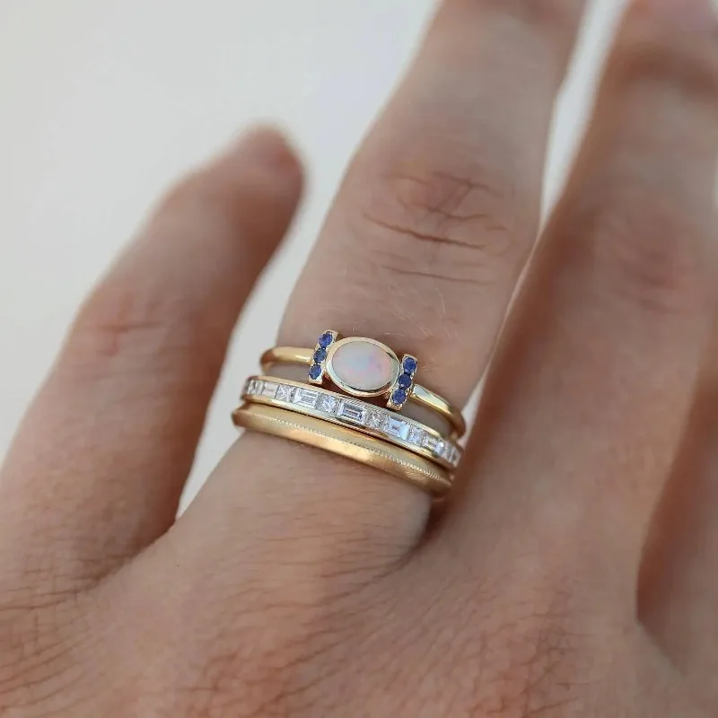 Elegant gold opal ring set with refined details