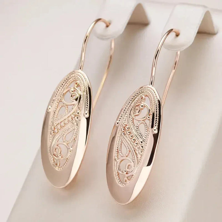 Refined gold dangle earrings with subtle shine