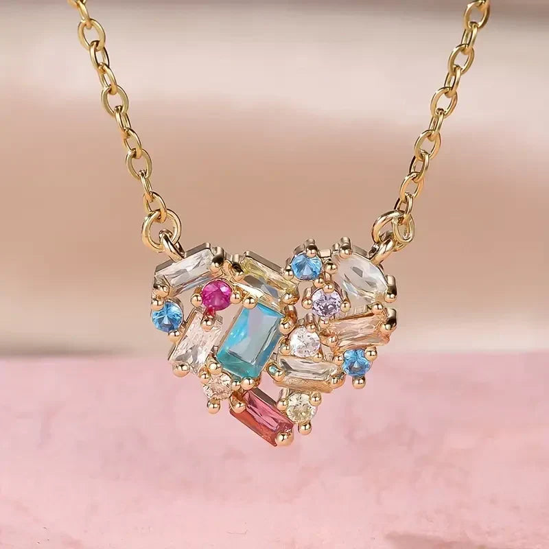 Elegant gold necklace with colorful little heart