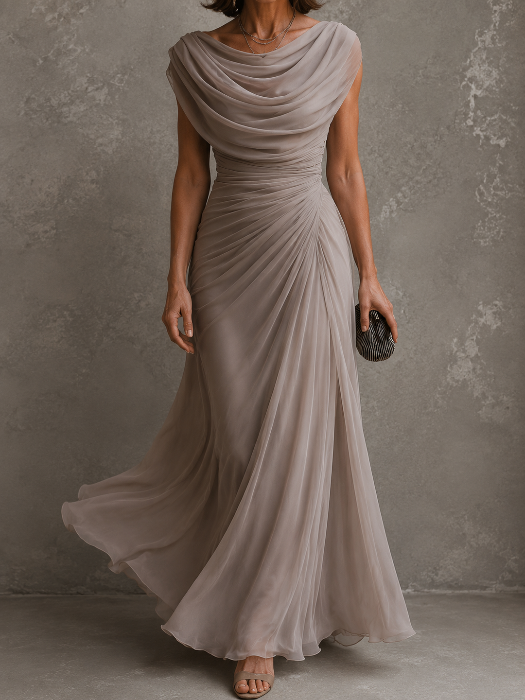 Draped sleeveless maxi dress with flowing floor-length skirt
