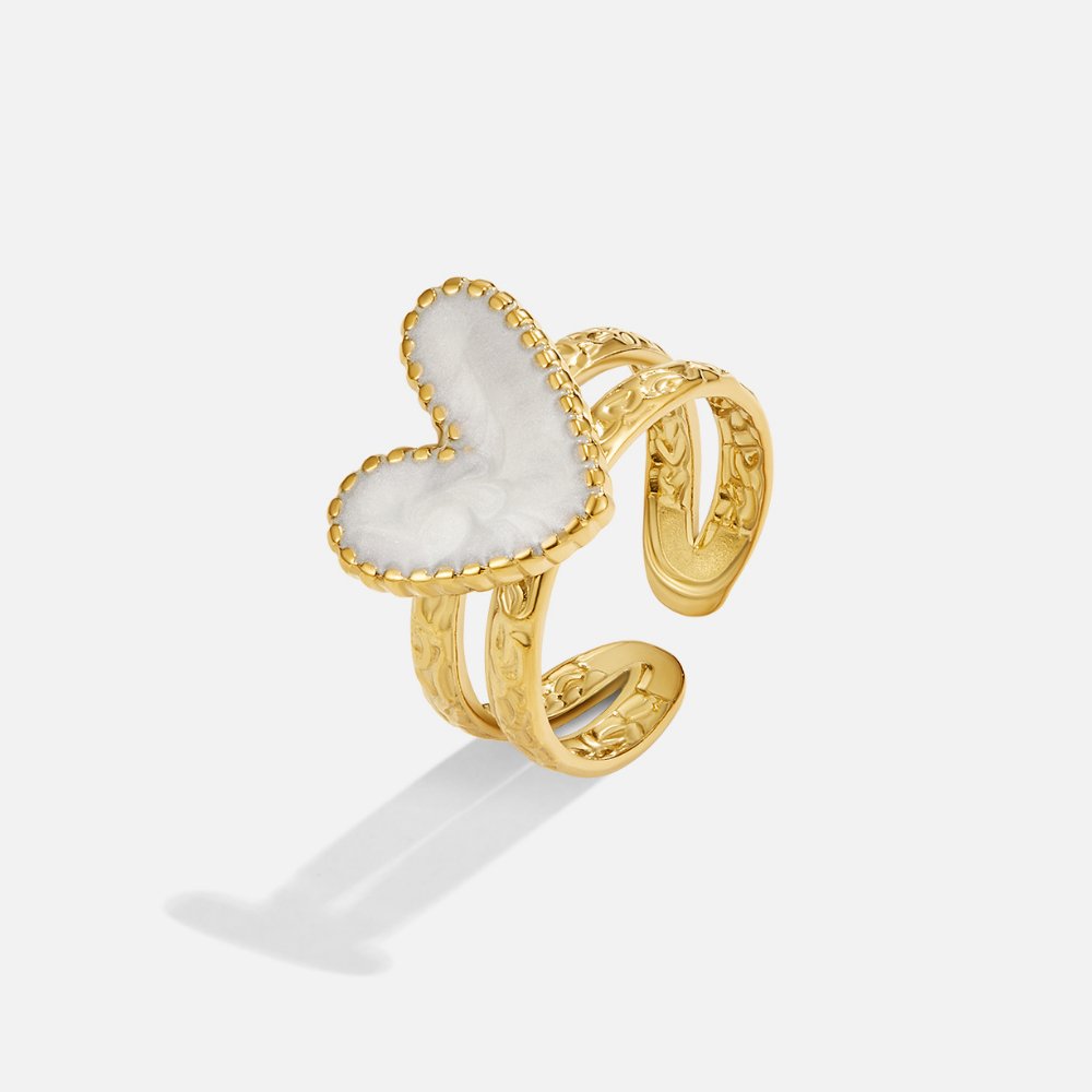 Simple gold ring with little heart