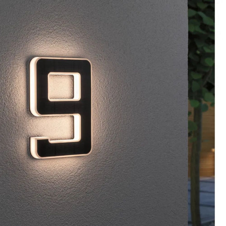 Solar-lit house number with LED and dusk sensor
