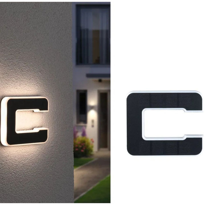 Solar-lit house number with LED and dusk sensor